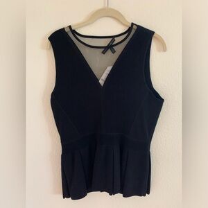 WHBM black sheer yoke peplum top. Size medium, new with tags